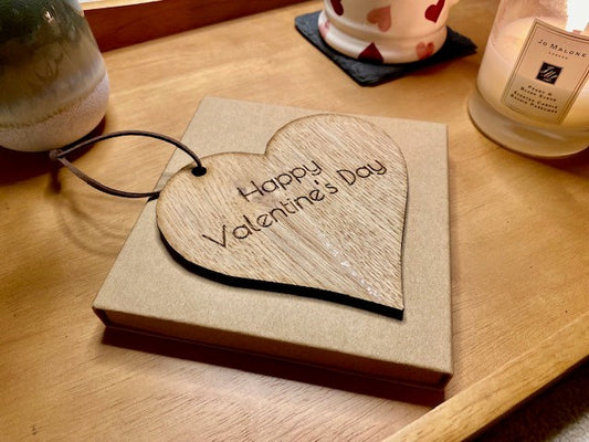 Cut out heart with 'Happy Valentines day' engraved.