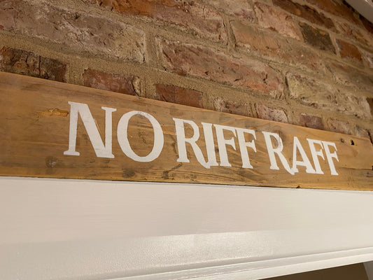 picture of no riff raff sign above door